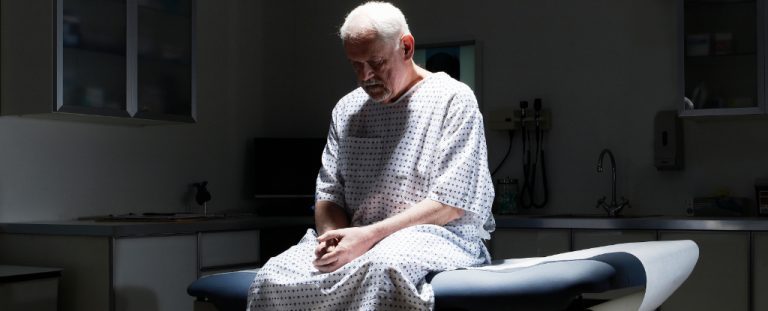 Old Person In Hospital Gown Header.jpg