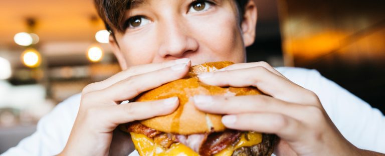 Teen Eating Burger.jpg