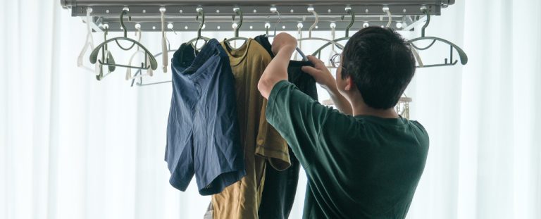 Man Hanging Washing Inside Header.jpg