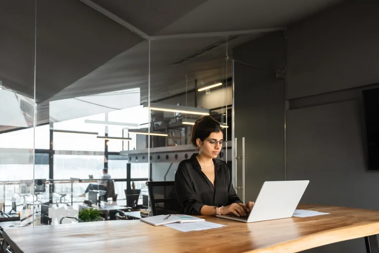 2733899 Young Businesswoman Sitting At Desk Workplace Working On Computer A1c8281617.webp